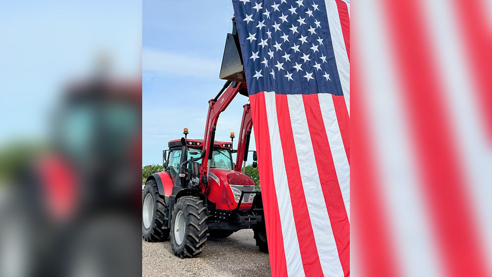 Kubota Tractor holding a American Flag