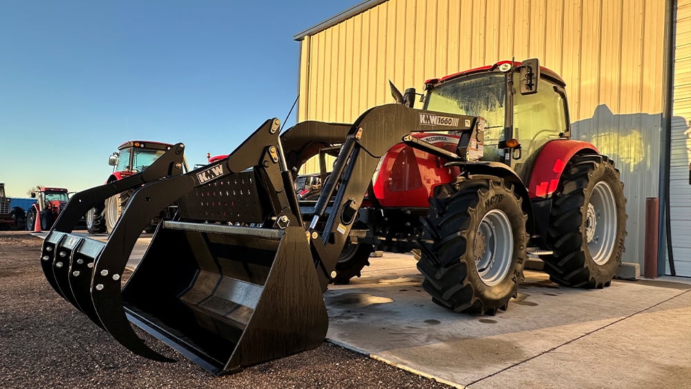 Kubota tractor being displayed in the sunset