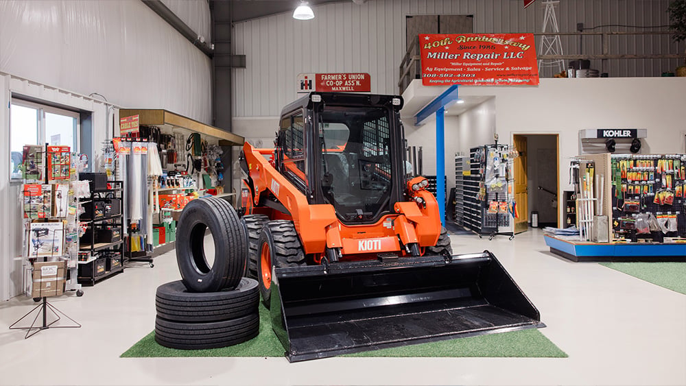 a loader next to spare tires