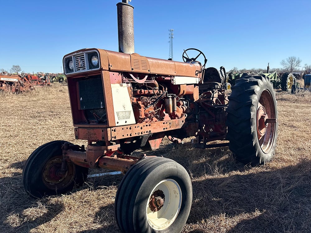 Orange salvaged tractor with the label 665