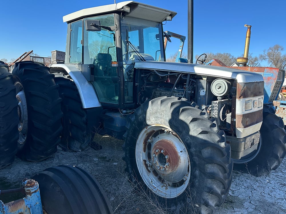 White Salavaged Tractor used for parts