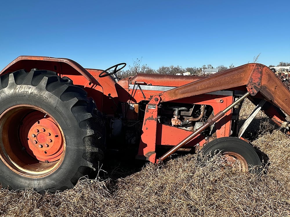 Red salvaged compact tractor