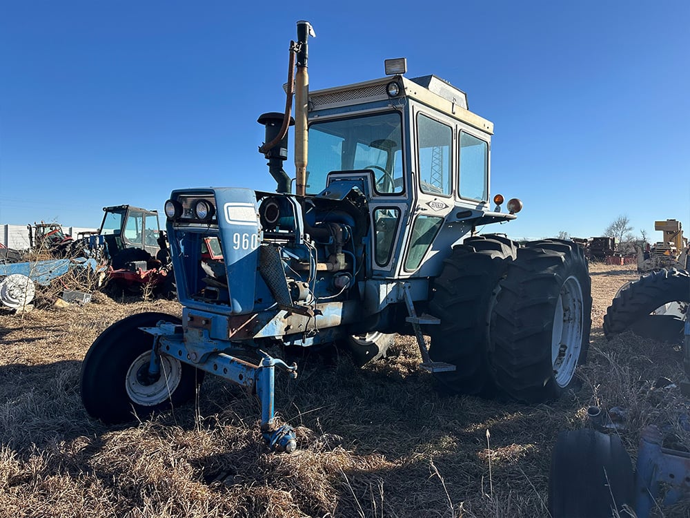 Salvaged blue Hiniker tractor 960