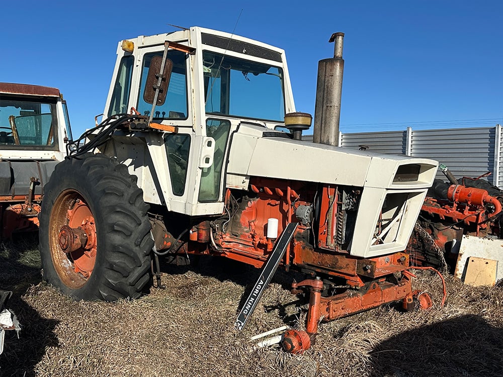 Salvagd white Agri King tractor mising front tired