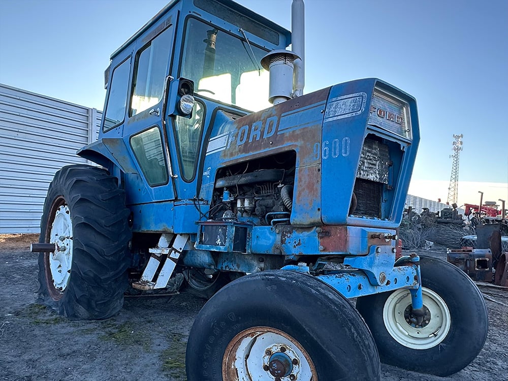 Salvaged blue Ford tractor 9600