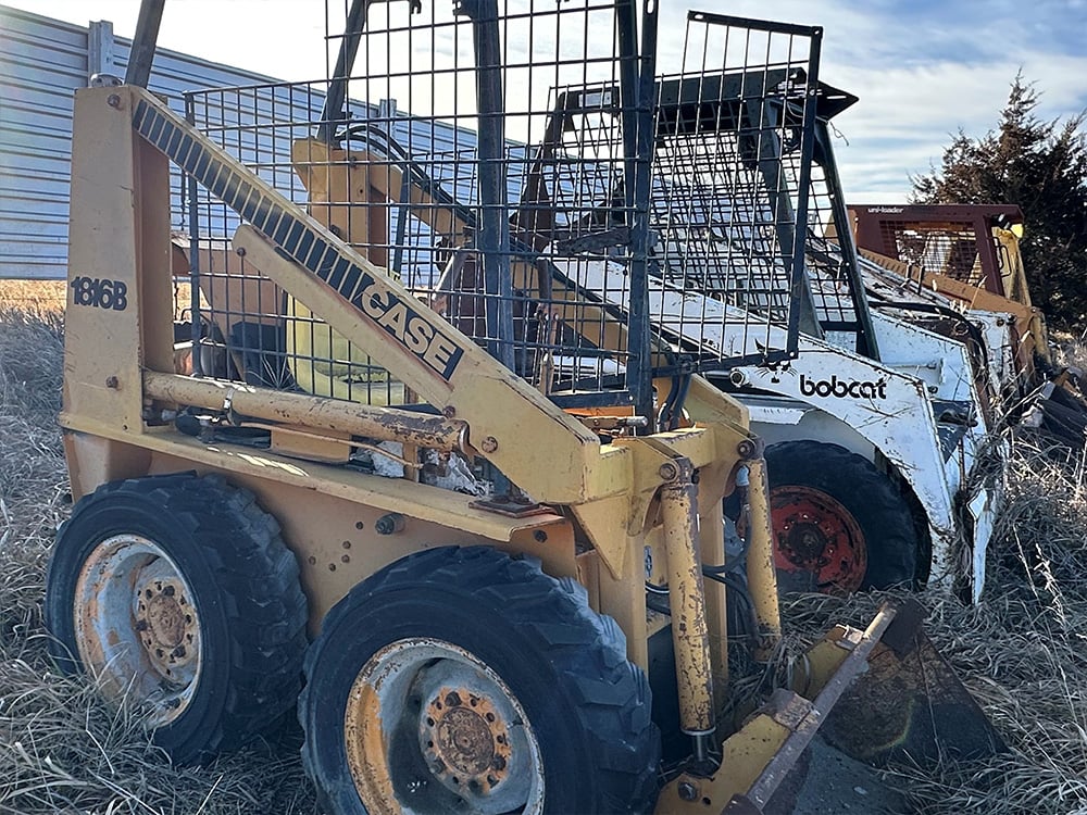CASE salvaged Uni-loader next to a Bobcat loader