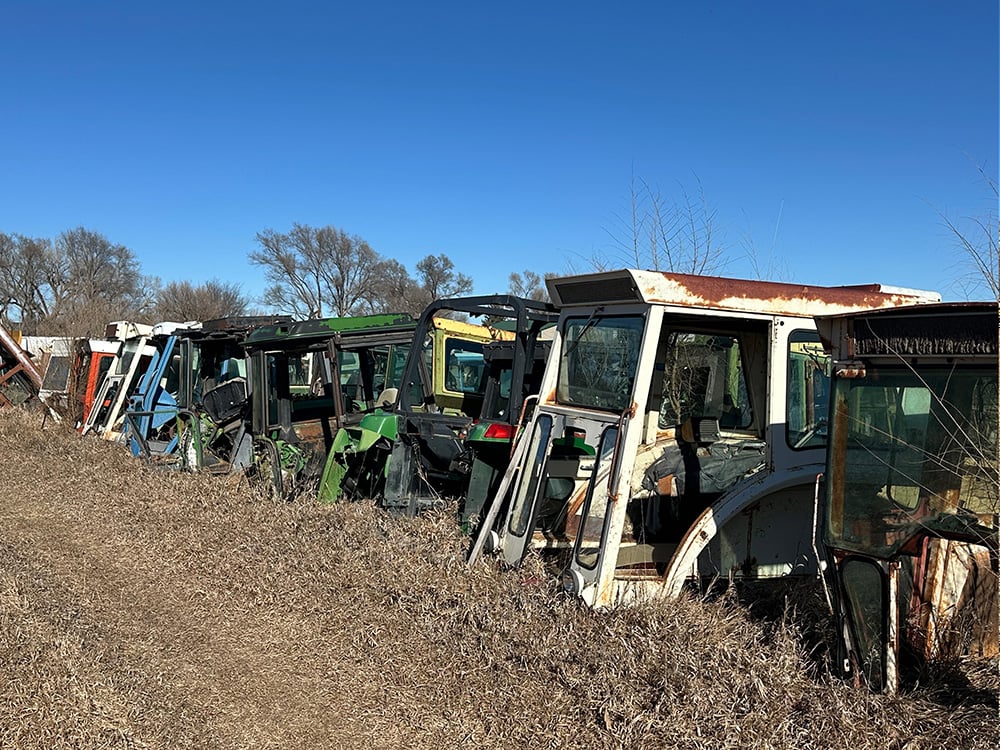 Variety of tractor tops in different colors used for parts